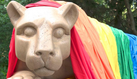 Lion shrine draped in rainbow flag