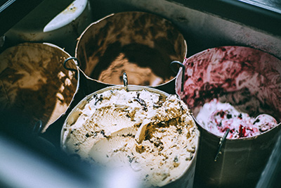 overhead view of open ice cream tubs