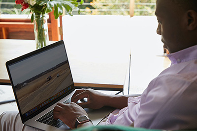 person typing on a laptop